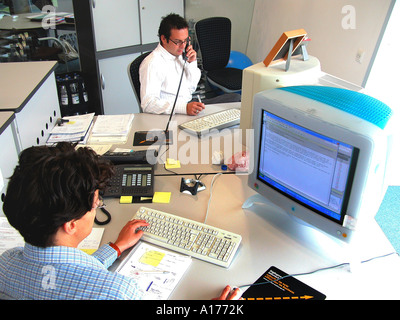 Man in the office with computer Stock Photo