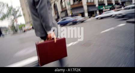 Businessman with briefcase in New York City Stock Photo