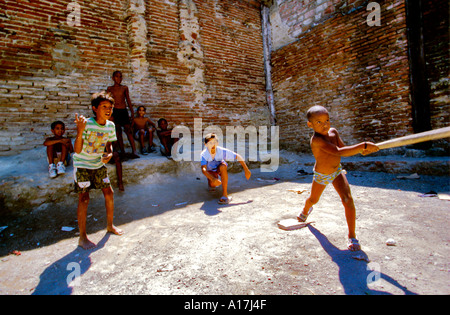 Seven Cuban children playing baseball Stock Photo