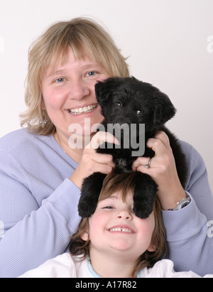 Mother Daughter and New Puppy Stock Photo
