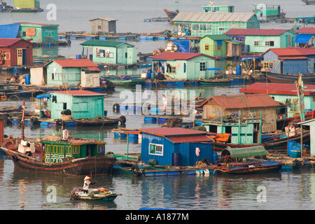2007 Floating City Houseboat Community in Harbor off Cat Ba Town Halong Bay Vietnam Stock Photo