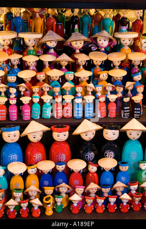 Small Wooden Figures of Vietnamese People in a Souvenir Shop Hanoi Vietnam Stock Photo