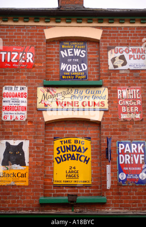 A COLLECTION OF OLD TIN ADVERTISING SIGNS IN THE GLOUCESTERSHIRE TOWN OF ROSS ON WYE UK Stock Photo