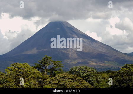 Arenal Volcano Costa Rica with smoke and cloud cover Stock Photo