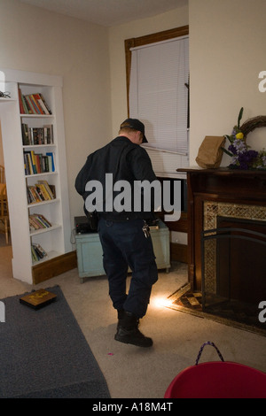 Crime Scene Technician photographs bedroom after a burglary. Kansas City, MO, PD Crime Lab. Stock Photo