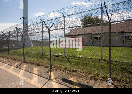 Perimeter fence and water tower.  Nebraska Correctional Center for Women in York Nebraska USA. Stock Photo