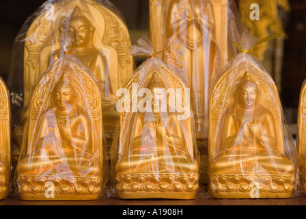 Tourist souvenirs of Buddha for sale in the Shwe zi gon Pagoda shop Bagan Myanmar Burma 2006 Stock Photo