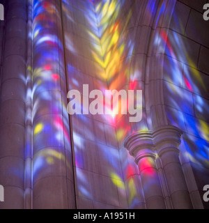 Walls of a cathedral highlighted by stained windows light. Stock Photo
