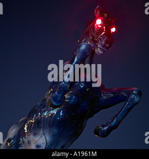 Horror black horse with red eyes and blood in a dark creepy atmosphere ...