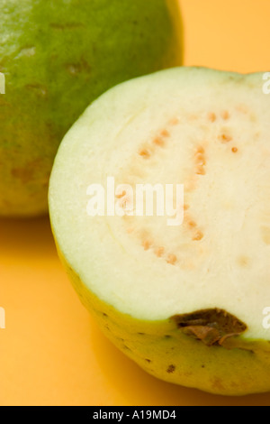 Partially Ripe Guava Whole and half fresh guava on white background Stock Photo - Alamy