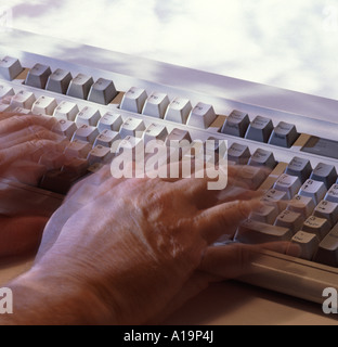 Motion blur action on wrist and fingers using a computer keyboard Stock Photo