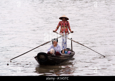 Ladies crossing the river on a water taxi, Mekong Delta, Vietnam Stock Photo