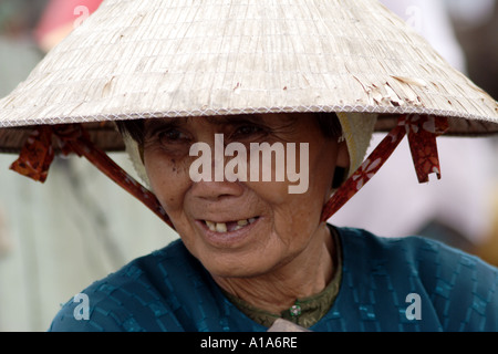 Aging woman in a traditional hat, Mekong Delta, Vietnam Stock Photo