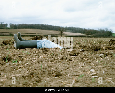 Farmer inside a hole Stock Photo