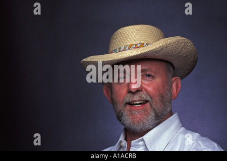 Smiling man wearing Panama Hat made of straw Stock Photo