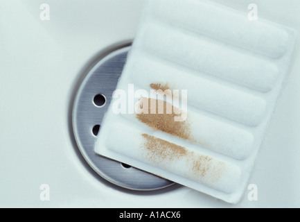 A used cotton pad in a sink Stock Photo