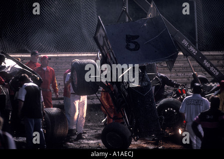 USA Washington Sedro Woolley Tow truck lifts car wreck aftermath from dirt track at Skagit Speedway Stock Photo