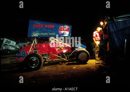 USA Washington Sedro Woolley Pit crew works on sprint car between races at Skagit Speedway on summer evening Stock Photo