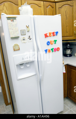 Refridgerator with magnetic letters spelling Keep out Fatso Stock Photo