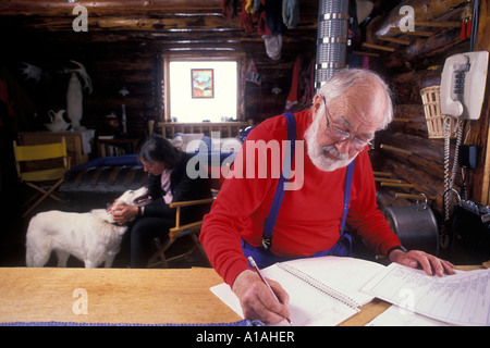 USA Alaska Trapper Creek Antarctic dog musher Norman Vaughan 86 works at home in his remote cabin Stock Photo