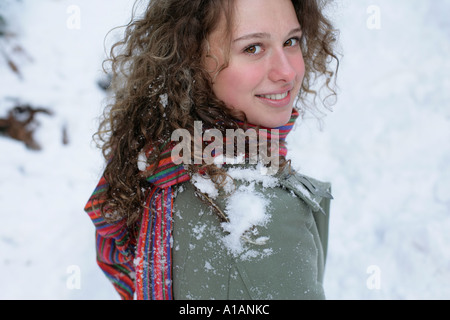 Woman with snow on her shoulder Stock Photo