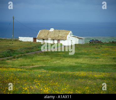 thatched dwelling on irelands scenic atlantic  county clare coast, beuty in nature, Stock Photo