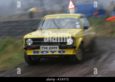 Mark II 2 escort blurred sliding taking a corner at the Toshiba Rally in Ballypatrick Forest County Antrim Northern Ireland Stock Photo
