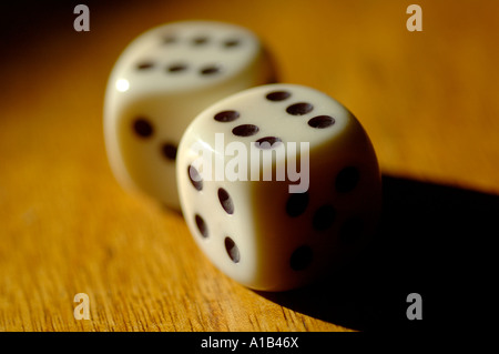 Two white, standard six-sided dice showing the number six on their top faces, Stock Photo