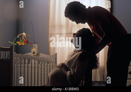 expectant couple in their nursery Stock Photo