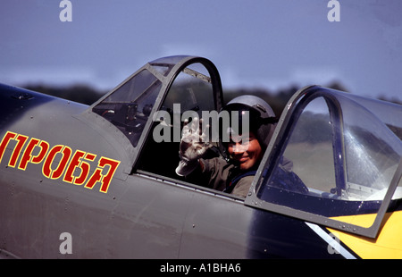 Pilot of a Russian Yak 50 aircraft of the Aerostars aerobatic display team at Rougham airfield, Bury St Edmunds in Suffolk, UK. Stock Photo