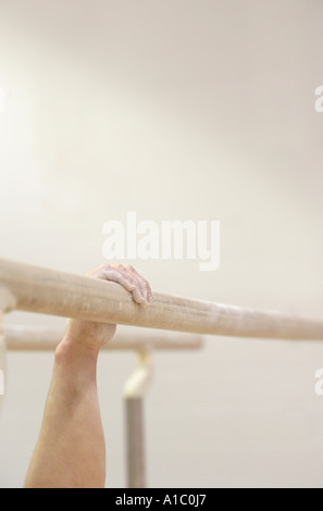 male gymnast on paralell bars Stock Photo