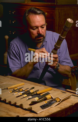 Dave Pepple works on the leg of a Federal table he is making at the North Bennet Street School in Boston Massachusetts Stock Photo