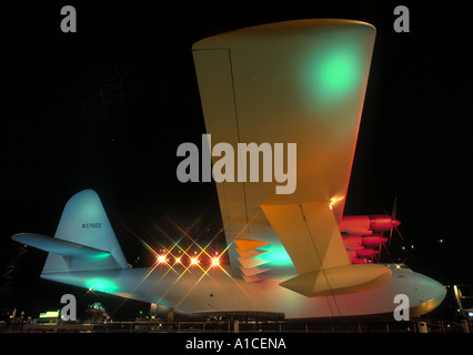 The Spruce Goose painted with colored light seen from the side inside the Long Beach, exhibition dome Stock Photo