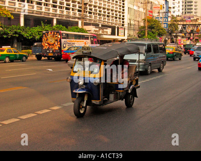 Tuk tuk motorized covered tricycle taxi Petchaburi Road Bangkok Thailand Stock Photo
