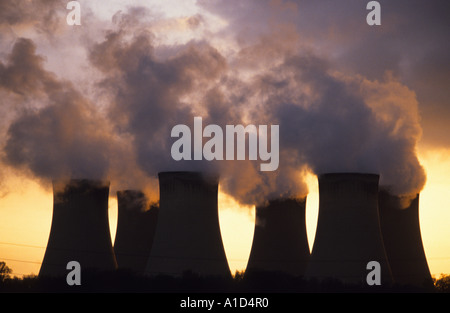 steam rising from giant cooling towers at drax coal powered power station at sunset drax yorkshire uk Stock Photo
