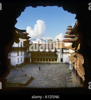 View out of window of Taleju temple looking over Kathmandu valley inner courtyard Nepal Asia window frame Stock Photo