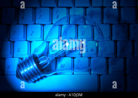 Light bulb on a keyboard (idea) Stock Photo