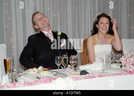 bride, and, groom, laughing, during, the, best, mans, speech, fun, funny, Stock Photo