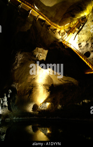 Kopalnia solna Wieliczka salt mine, illuminated wooden gallery above pool of salty water, Poland 2006 Stock Photo