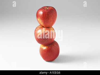 Three red apples, stacked one on the other Stock Photo