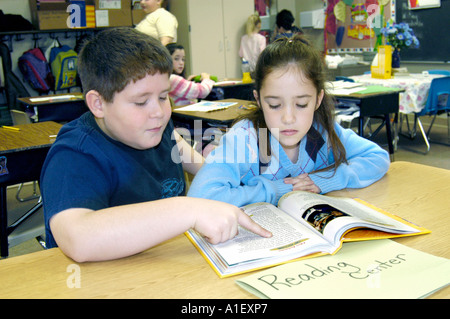 Boy and girl students in an Elementary school learning situation Stock Photo