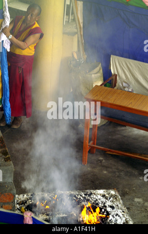 Tibetan buddhist monk preforming fire puja ritual in Namgyal monastery ...