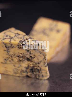 Stiton Stilton mature blue mouldy cheese - Dark background Stock Photo - Alamy