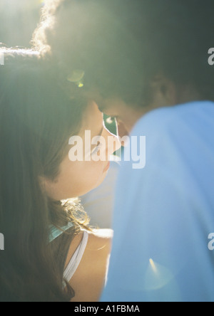 Teenage couple about to kiss Stock Photo