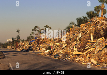 Debris from Hurricane Charlie piled along the road in Punta Gorda Florida  Stock Photo