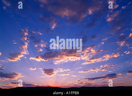 Rays of light through sunset clouds Near the Steens Mountain Oregon Stock Photo