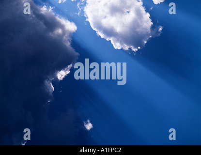 Rays of sunlight through clouds Stock Photo