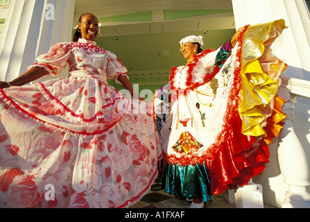 CARIBBEAN Netherlands  Curacao Colorful Ladies in Dance Costumes Mansion Ville Maria Stock Photo