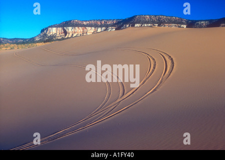 Tire tracks on sand dune Stock Photo