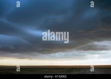 Dark menacing storm clouds over Colorado field USA Stock Photo
